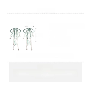 Detail view of rhinestone bow tassel earrings with dimensions 14cm x 6.5cm and specs