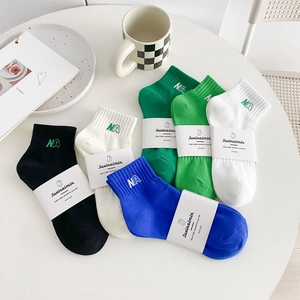 Five pairs of Japanese style cotton socks in green and blue colors with NA embroidery