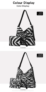 Detail view of zebra print PU shoulder bag set including a large tote and a small pouch