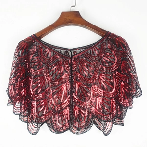 Elegant red and black sequin mesh shawl shrug for evening gowns on a wooden hanger