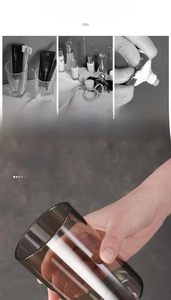 Detail of a thickened amber transparent mouthwash cup with minimalist cylindrical design