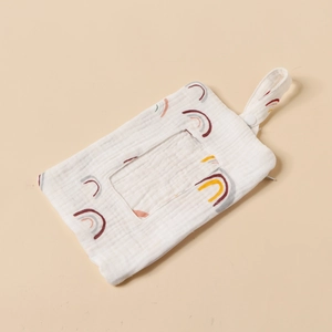 Detail of soft cotton baby wipes organizer bag with rainbow patterns and hanging strap