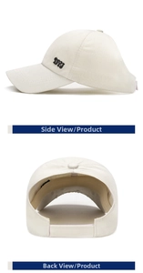 Detail view of cream ponytail baseball cap featuring black DYJ embroidery and back strap