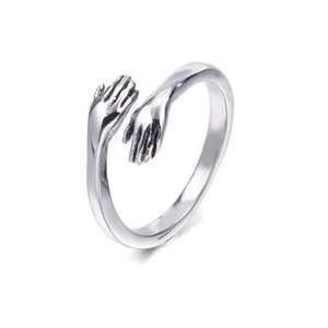 Adjustable silver hugging hands open ring with a minimalist polished metal design