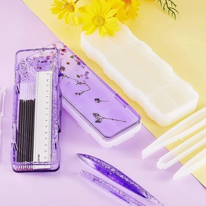 DIY silicone molds for resin pens and rulers with purple glitter and stationery accessories