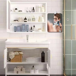 Modern white bathroom wall mirror cabinet with organized shelves and skincare products