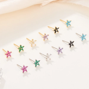 Macro shot of 925 sterling silver petal stud earrings with colorful zircon stones