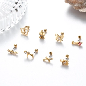 Detail shot of golden stainless steel stud earrings with colorful zirconia inlay designs