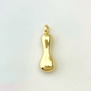 Detailed view of glossy gold balloon pendant with smooth polished metallic finish