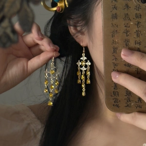 Vintage star water drop tassel earrings with gold finish and amber rhinestones