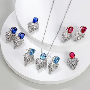 Luxury S925 silver jewelry sets with oval corundum pendants and feather-shaped earrings
