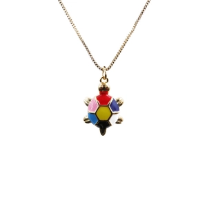 Gold-plated colorful enamel turtle pendant necklace with minimalist chain on white background