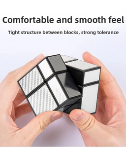Detail of silver mirror cube being turned showing internal structure and smooth rotating parts