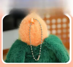 Close-up of cute parrot plush keychain featuring a silver bead chain and soft orange fur