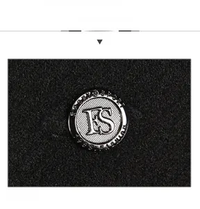 Detailed close-up of a silver Sport Fashion 1988 metal buckle on a black winter cap
