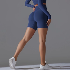 Detail view of seamless high waist yoga shorts in navy blue with scrunch butt design
