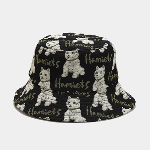 Close-up of black bucket hat with white dog jacquard patterns and Hamiets embroidery