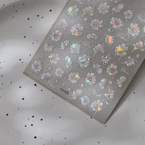 3D cherry blossom nail stickers with iridescent laser finish and small rhinestones