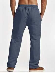 Rear view of men's blue striped linen trousers showing vertical texture and straight cut
