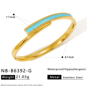 Detail view of gold stainless steel bangle with blue enamel and dimensions marking