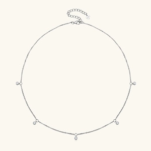 Close-up of S925 sterling silver stamp on a delicate heart pendant necklace chain