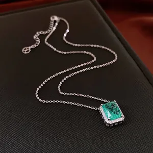 Luxury emerald-cut green zircon pendant necklace with pavé diamond halo on silver chain