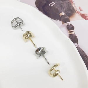 Minimalist metal hair hooks for ponytails in polished gold and silver finishes