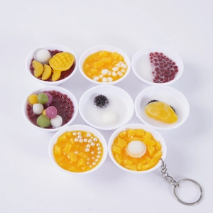 Miniature dessert bowl keychains featuring realistic mango pudding and red bean toppings