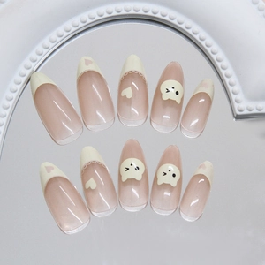 Cute French almond press-on nails with cream bear and heart patterns on pink base