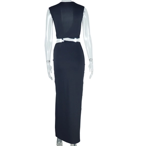 Detail view of the black two-piece set featuring a cropped top and slim maxi slit skirt