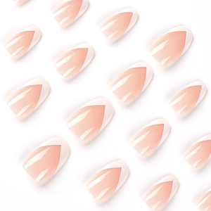 Minimalist nude and white V-shape French tip press on nails in medium long coffin shape