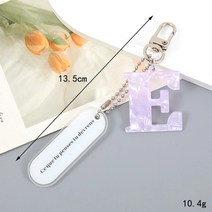 Detail of purple marble letter E keychain with silver hardware and measurements