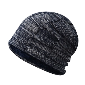 Detail of winter plaid knit beanie with thick fleece lining and warm chunky texture