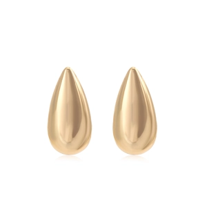 Macro view of teardrop gold stud earrings with a high-polish mirror finish and soft reflection