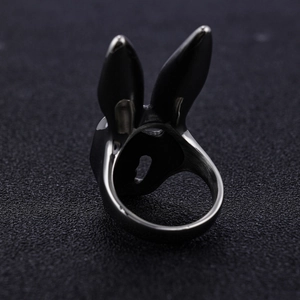 Macro detail of the black rabbit skull ring showing inner band and metal texture