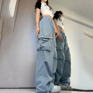 High-waisted light blue wide-leg cargo pants with large side pockets and straight drape
