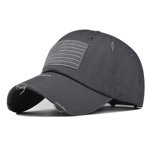 Close-up of distressed cotton baseball cap with vintage American flag patch detail