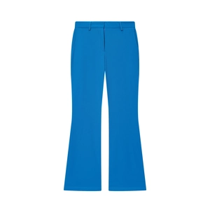 Détail du pantalon évasé à taille haute de couleur bleu vif avec coutures nettes