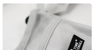 Detail of light gray mesh water bottle carrier featuring a black woven brand logo label