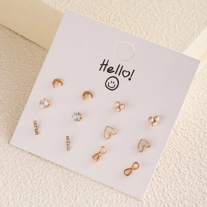 Detailed set of six gold-finish stud earrings featuring moon, pearl and heart motifs