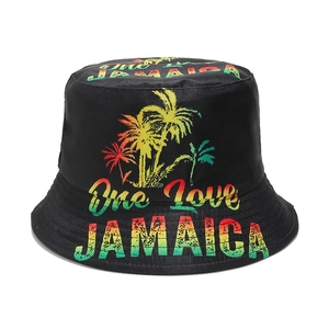Detail of One Love Jamaica bucket hat featuring red yellow green gradient text and palm trees