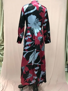 Detail of waist-slimming back design and colorful floral print on long A-line dress