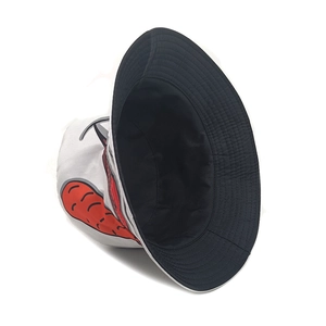 White bucket hat with red carrot print and black lining for sun protection