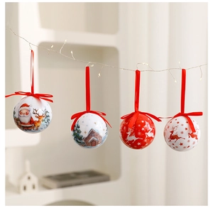 Detailed view of four 8cm red and white Christmas baubles with Santa and reindeer prints