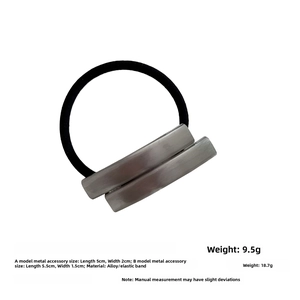 Close-up of a silver rectangular metal alloy hair tie with a black elastic rubber band