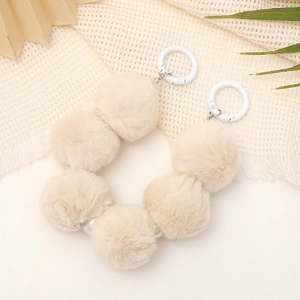 Beige faux fur pompom hand strap with metal rings for phone cases and handbags