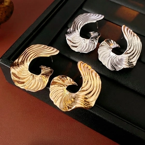 Irregular C-shaped wave texture earrings set in gold and silver finish for women