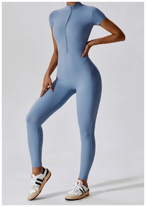 Close-up of light blue athletic bodysuit with high-neck zipper and short sleeves