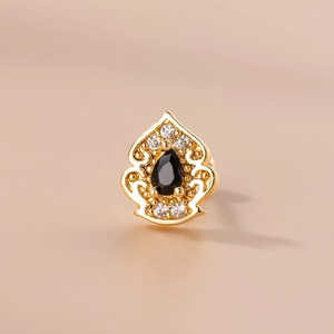 Detailed view of gold-plated hollow bud earring with black droplet zircon and tiny diamonds