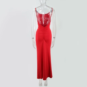 Detail view of red backless maxi dress with elegant ruching and draped fabric